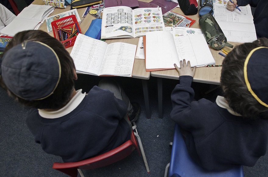 Students of the North Cheshire Jewish Primary school in Stockport, England, listening to a teacher, Dec. 7, 2006. (Christopher Furlong/Getty Images)