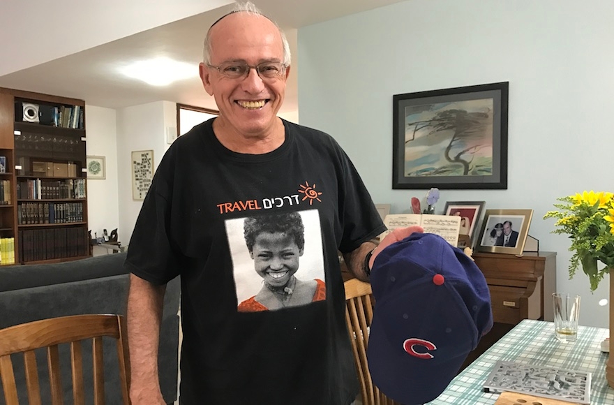 Michael Rich displaying his Chicago Cubs cap at his house in Karnei Shomron, West Bank, Oct. 28, 2016. (Andrew Tobin) 