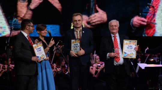 Limmud FSU founder Chaim Chesler, right. Lviv Mayor Andriy Sadovyi and Roman Kogan attending an event at the Lviv opera house on Nov. 6, 2016. (Photo: Boris Bukhman)