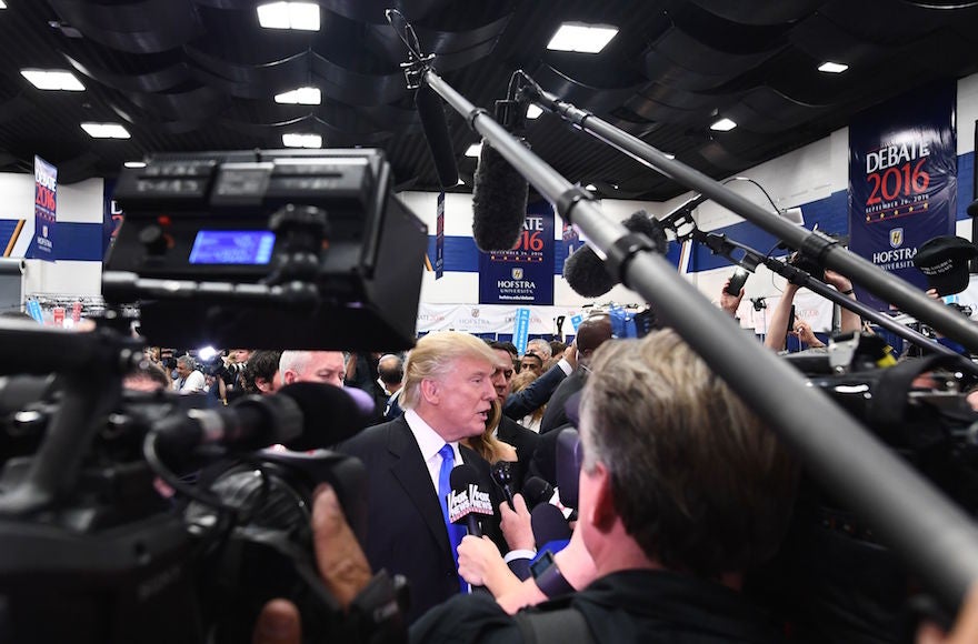 Donald Trump speaking with reporters in the 