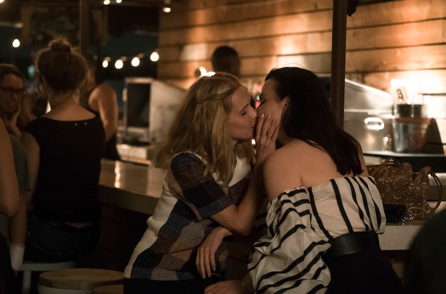 On "Younger," Malkie (Sally Pressman), left, and Maggie (Debi Mazar) kiss. (Courtesy of TV Land)