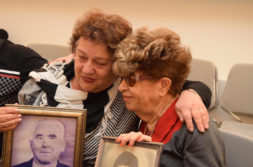 Fania Blakay, left, embracing her cousin Henia Moskowitz after they were united at the Yad Vashem Holocaust museum in Jerusalem, Dec. 13, 2016. (Courtesy of Yad Vashem).