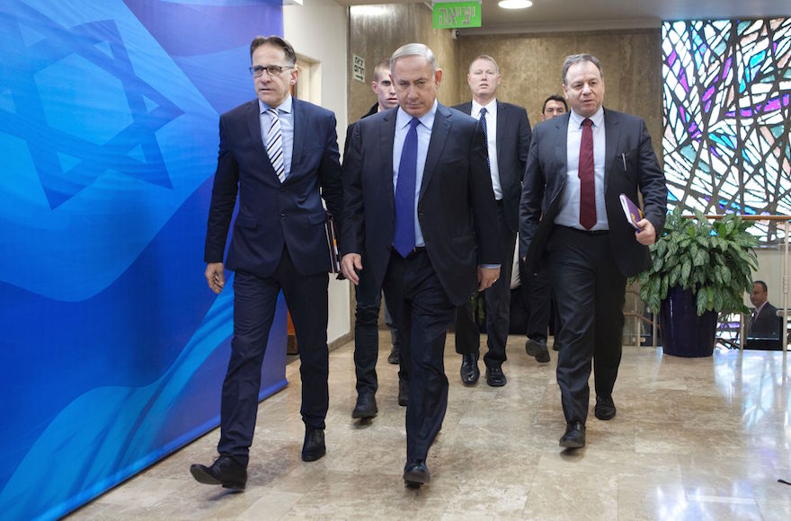 Israeli Prime Minister Benjamin Netanyahu, center, arriving at his weekly cabinet meeting in Jerusalem, Dec. 25, 2016. (Dan Balilty/AFP/Getty Images)