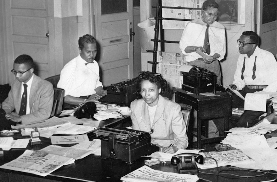 The Defender newsroom on Chicago's South Side in the late 1940s, with Audrey Weaver, the first woman city editor of any American newspaper, in the center. (Courtesy of Abbott Sengstacke Family Papers) 