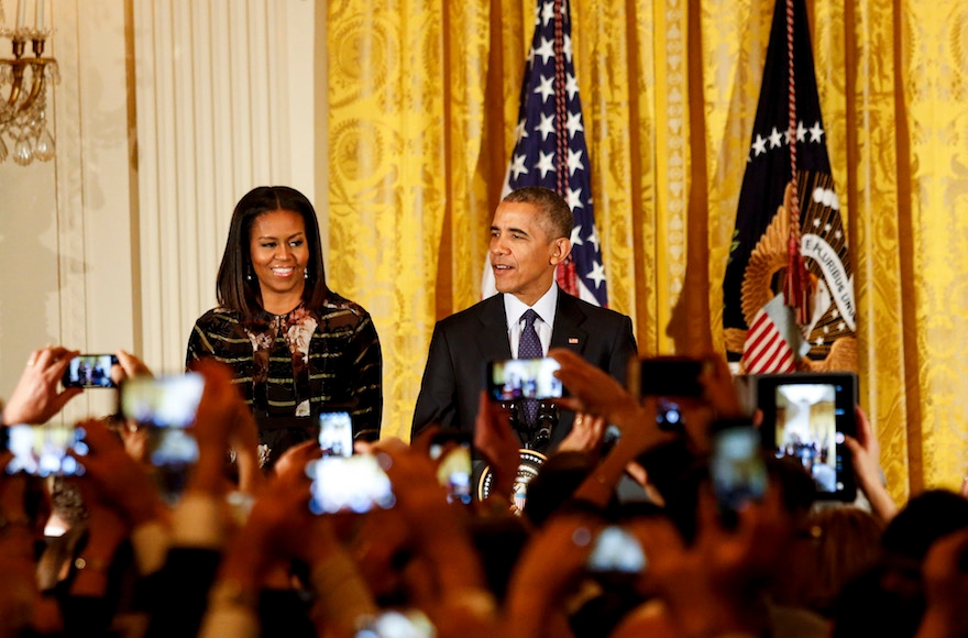 President Barack Obama and First Lady Michelle Obama attending the second Hanukkah reception of the day in the East Room of the White House in Washington, Dec. 14, 2016. (Aude Guerrucci-pool/Getty Images)