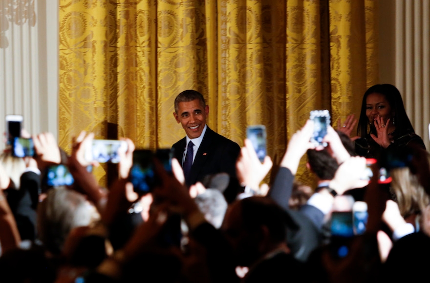 President Barack Obama and First Lady Michelle Obama attending a Hanukkah reception in the East Room of the White House in Washington, Dec. 14, 2016. (Aude Guerrucci-pool/Getty Images)