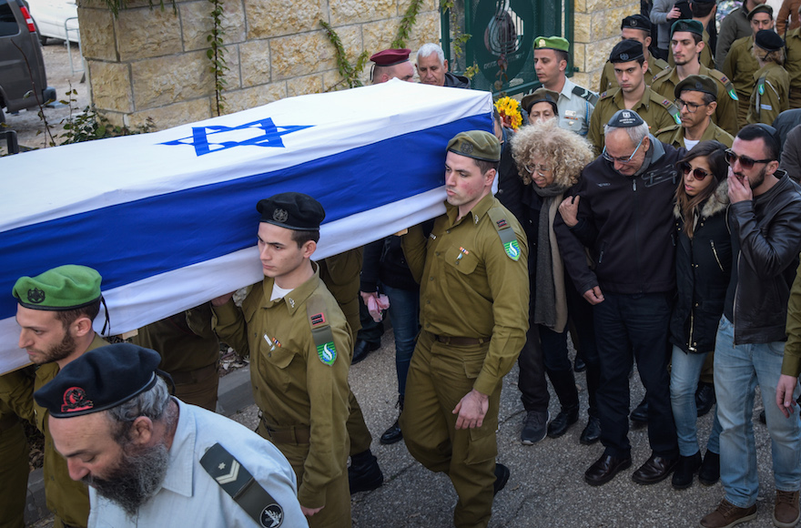 Family and friends mourning at the funeral of IDF Lieutenant Yael Yekutiel, one of the soldiers killed in a truck ramming attack a day earlier in Jerusalem, at the military cemetery in Kiryat Shaul, outside of Tel Aviv, Jan. 9, 2017. (Hadas Parush/Flash90