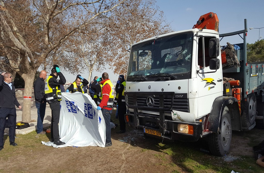 Members of ZAKA search and rescue organization gather human remains from a truck ramming attack in eastern Jerusalem that killed 4 Israeli soldiers and injured 15 others on Jan. 8, 2017. (ZAKA photo by Yehezkiel Itkin)