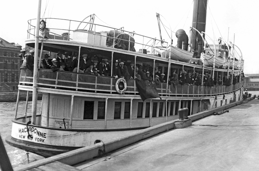 Immigrants arriving at Ellis Island aboard the tender Machigonne in New York, Aug. 21, 1923. (Underwood Archives/Getty Images)