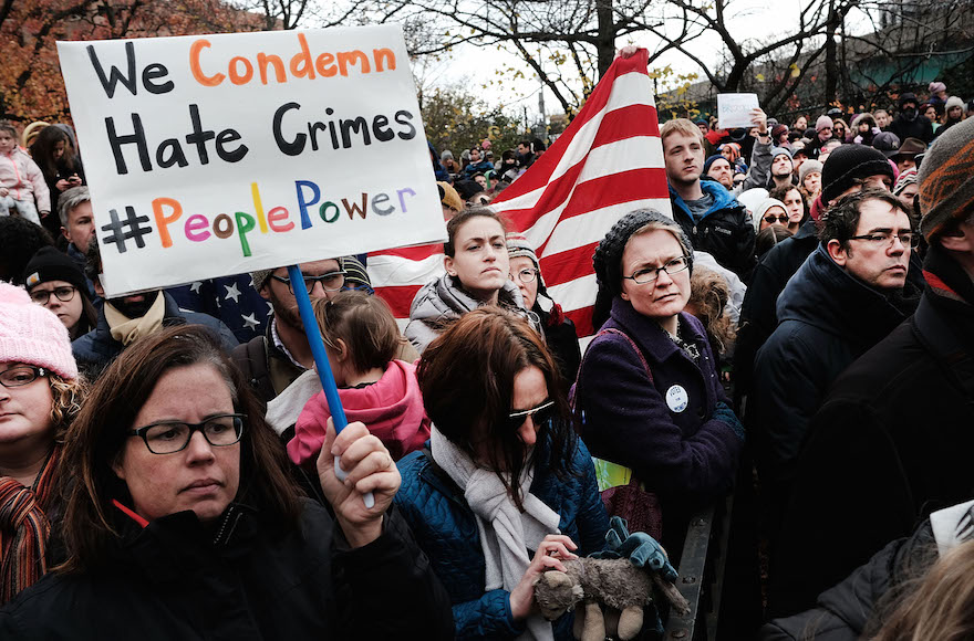 People participating in an anti-hate rally at a Brooklyn park named in memory of Beastie Boys band member Adam Yauch after it was defaced with swastikas in New York City, Nov. 20, 2016. (Spencer Platt/Getty Images)