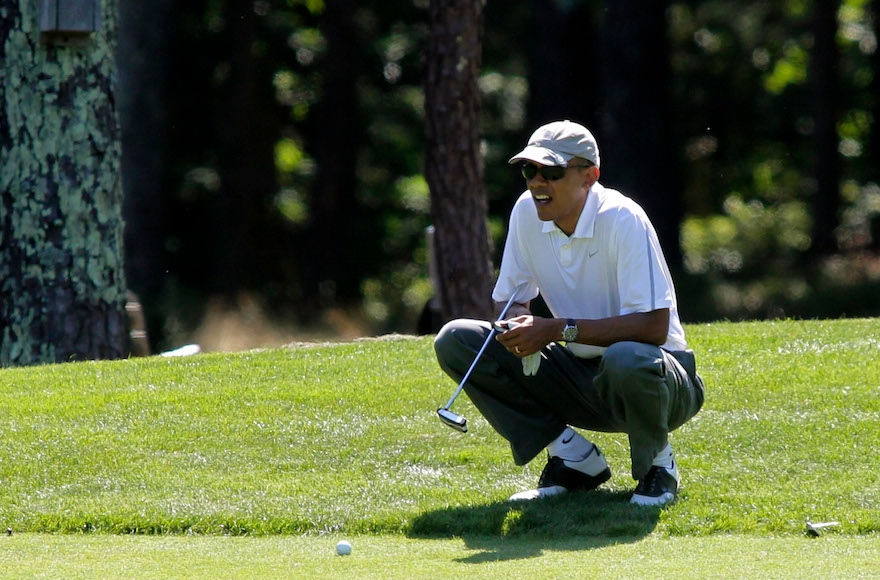 President Barack Obama golfing at Oak Bluffs, Mass., Aug. 9, 2014. (Matthew Healey/Bloomberg/Getty Images)