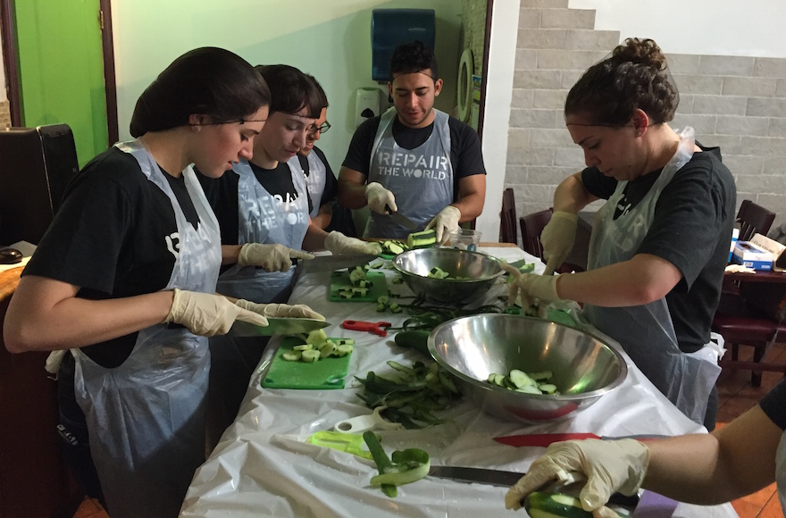 Repair the World volunteers assisting with food preparation at Masbia Soup Kitchen in Brooklyn. (Alli Lesovoy)