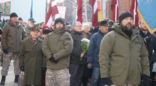 SS veterans and their supporters march in Riga, Latvia on March 16, 2018. (Cnaan Liphshiz)