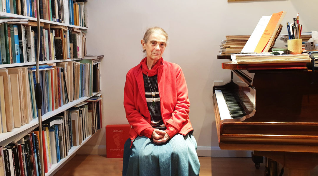 Nelly Ben-Or sitting by one of her two pianos in her London home