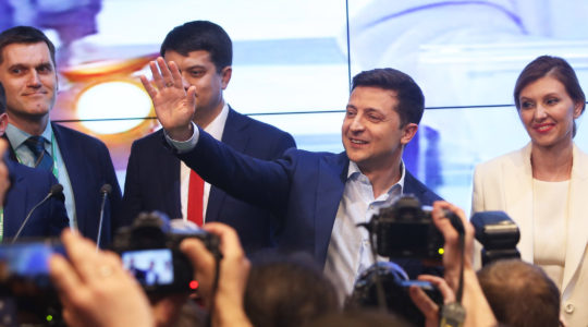 Volodymyr Zelensky, second from right, waves to supporters at his campaign headquarters in Kiev, Ukraine, April 21, 2019. (Xinhua/Sergey/Getty Images)