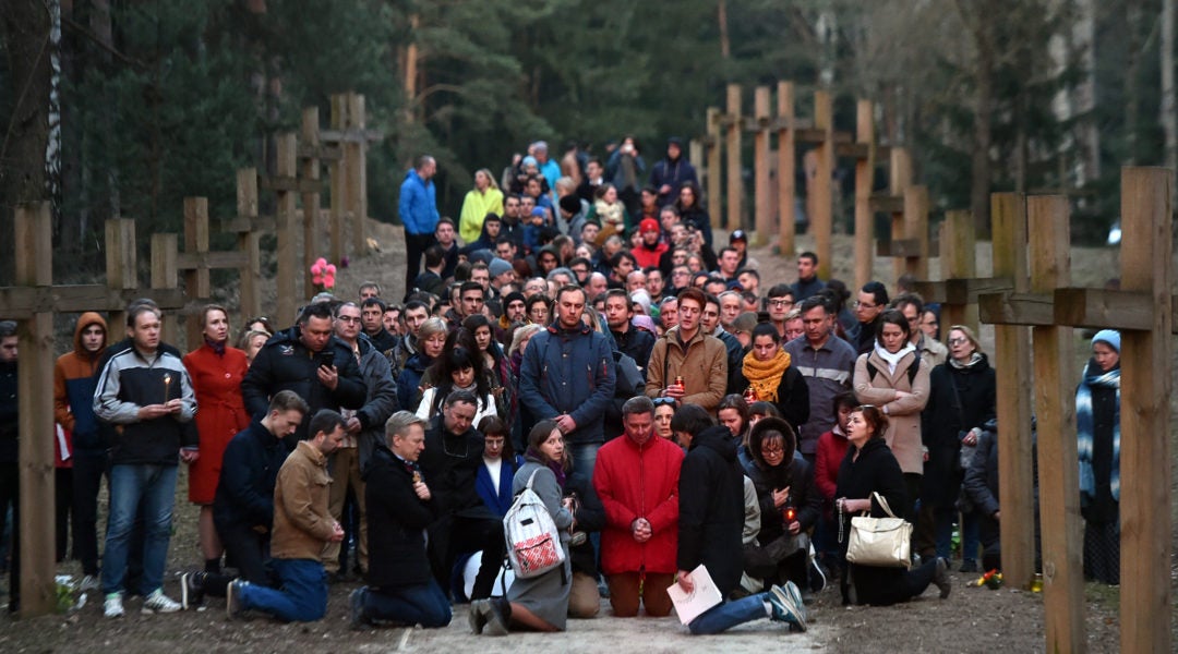 People attending a public prayer at the Kuropaty memorial site in Minsk on April 4, 2019. (Photo by Sergei Gapon/AFP/Getty Images)