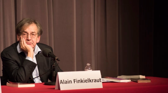 Alain Finkielkraut preparing to answer a question at an appearance in Brussels, Belgium on April 3, 2016. (Cnaan Liphshiz)
