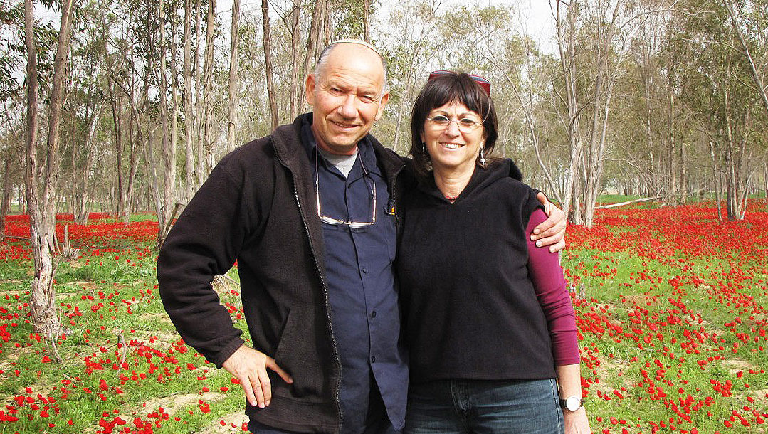 Yoskeh and Nurit Mamrmurstein enjoying winter blossoms in Alumum, Israel in 2012. (Courtesy of Yoskeh)