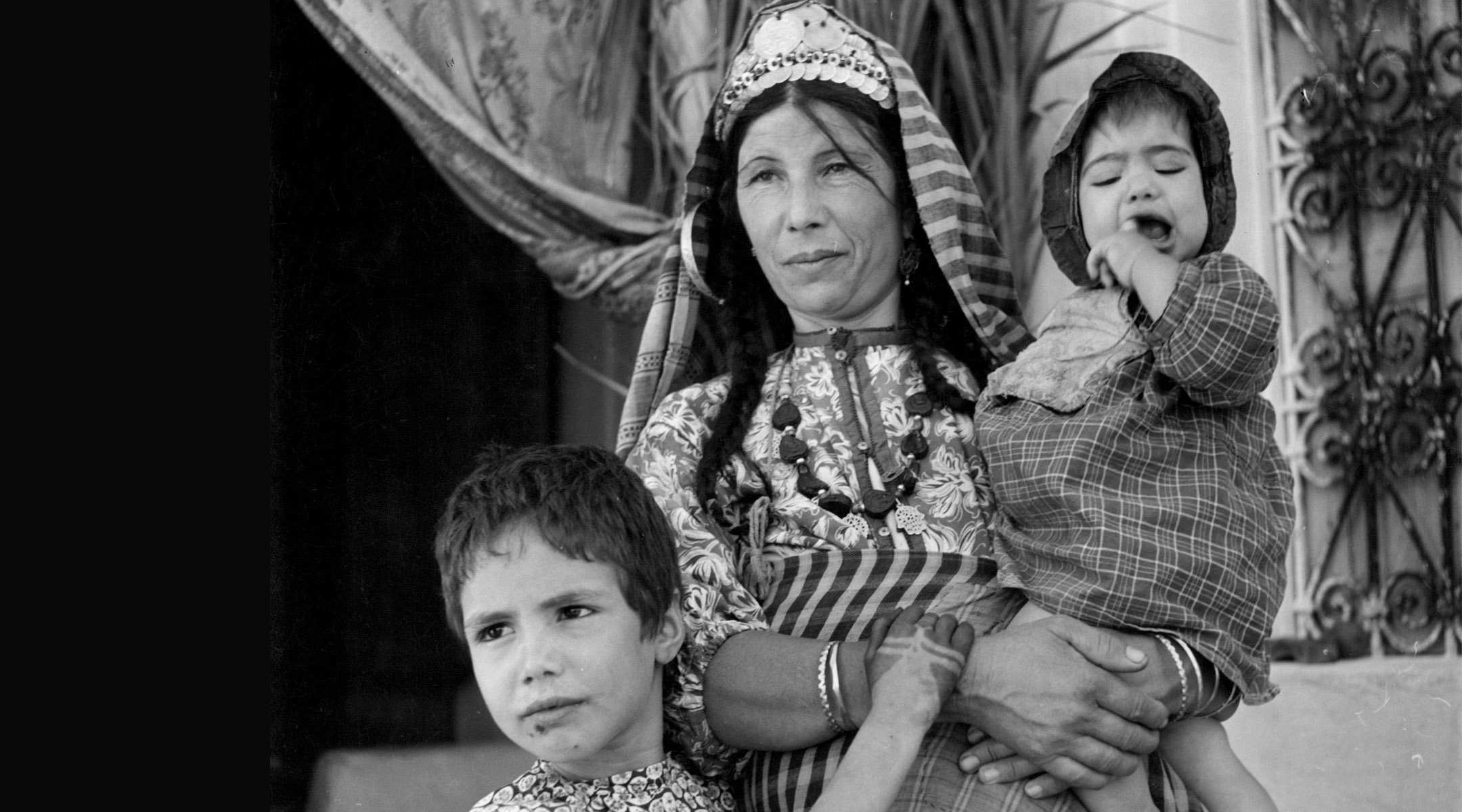 Young children, tired of the stifling atmosphere of the synagogue, come outside to be with their mother in Djerba, Tunisia. January 01, 1950. 850,000 refugees from Tunisia and other Arab countries were expelled after the creation of Israel. (Graphic House/Archive Photos/Getty Images)