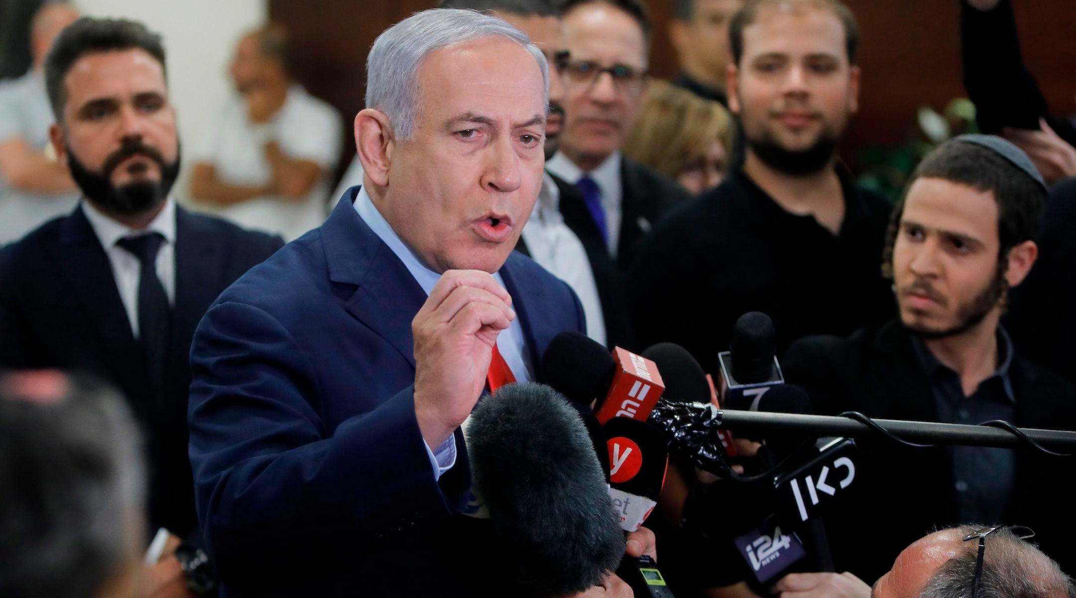 Israeli Prime Minister Benjamin Netanyahu talks to the press following a vote on a bill to dissolve the Israeli parliament in Jerusalem, May 29, 2019. (Menahem Kahana/AFP/Getty Images)