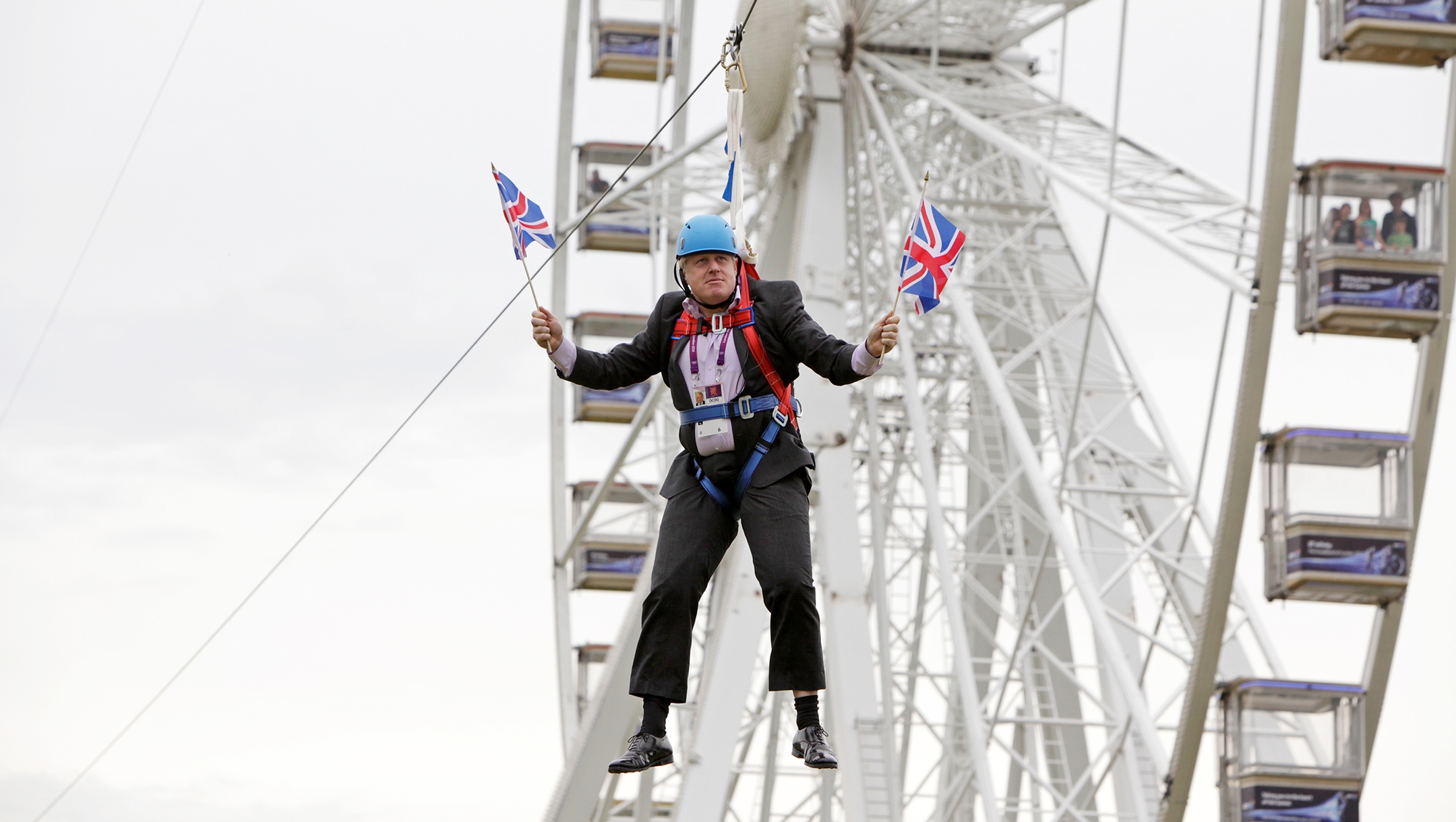 British Prime Minister-elect Boris Johnson waiting to glide on a zip line onto the Olympic Park in London, the United Kingdom, on August 1, 2012. (Barcroft Media / Barcroft Media via Getty Images)