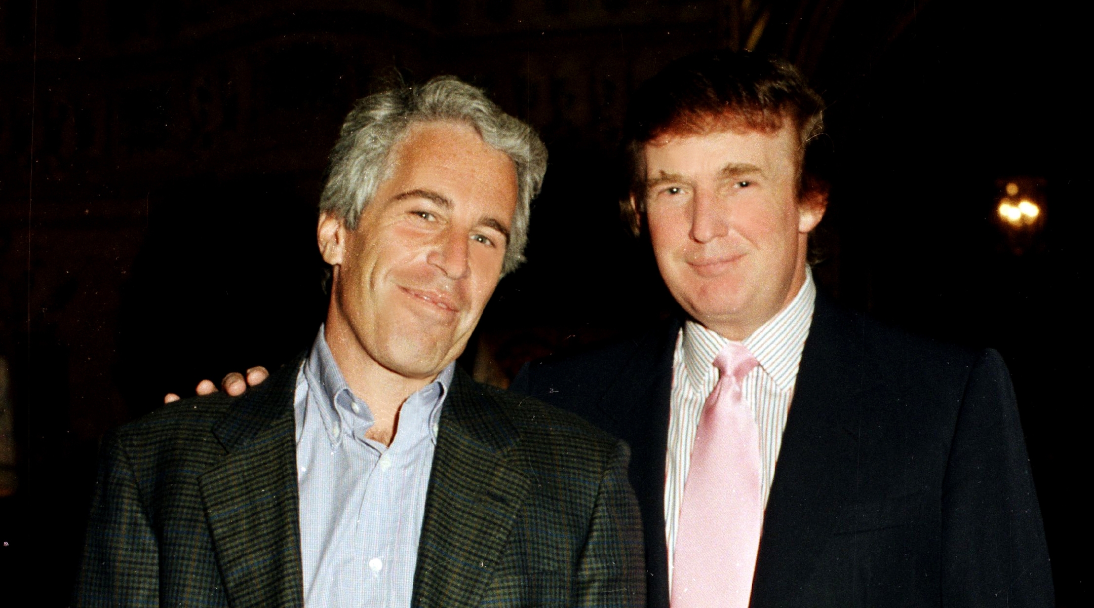 Jeffrey Epstein with Donald Trump at Trump's Mar-a-Lago estate in Palm Beach, Fla., in 1997. (Davidoff Studios/Getty Images)