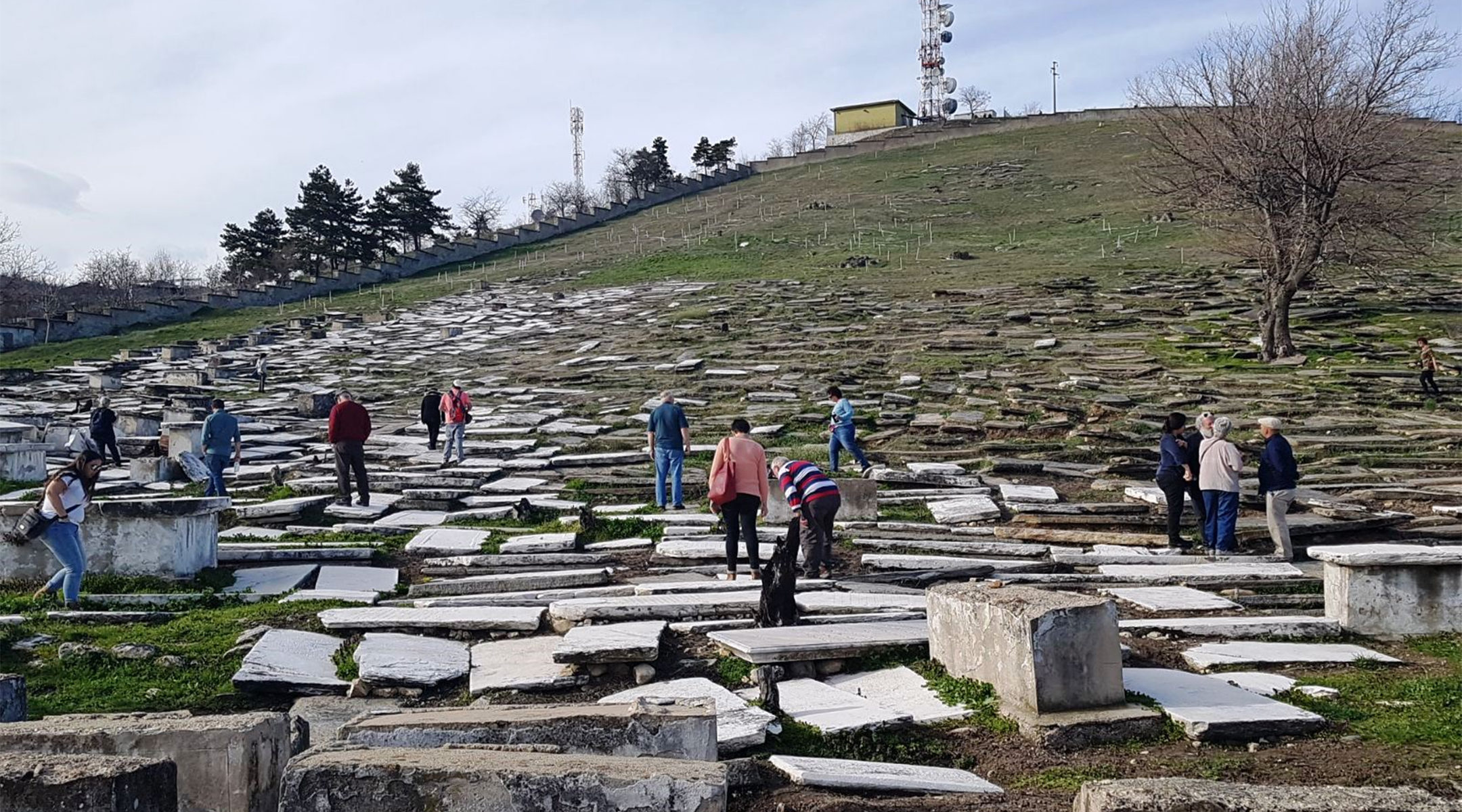 Visitors touring the Jewish cemetery of Bitola, Macedonia in 2018. (Wikimedia Commons/Yael Unna)