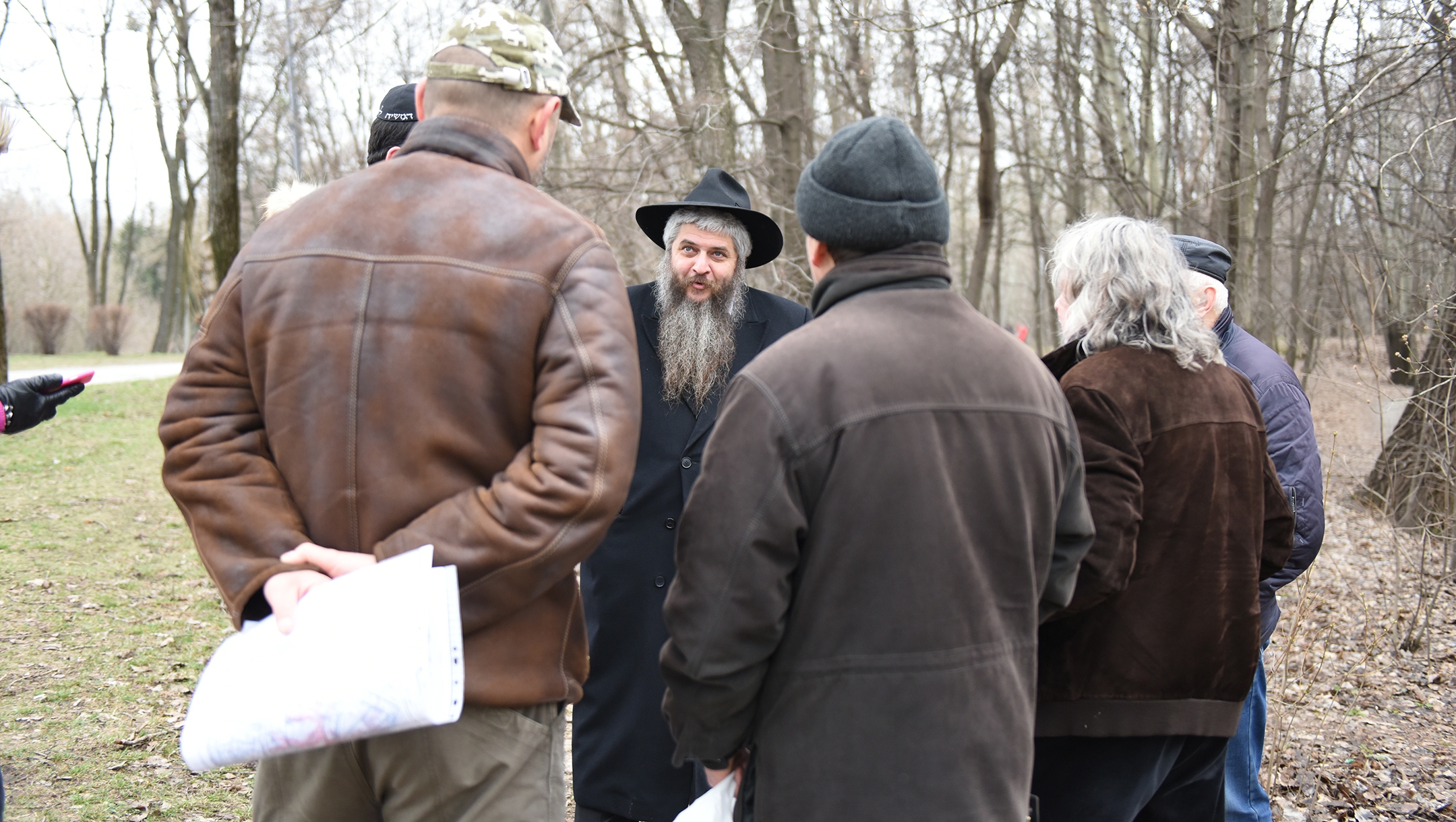 Moshe Azman, a Ukrainian rabbi, discussing with architects the construction of a Holocaust museum near the Babi Yar monument in Kiev, Ukraine on March 14, 2016. (Cnaan Liphshiz)