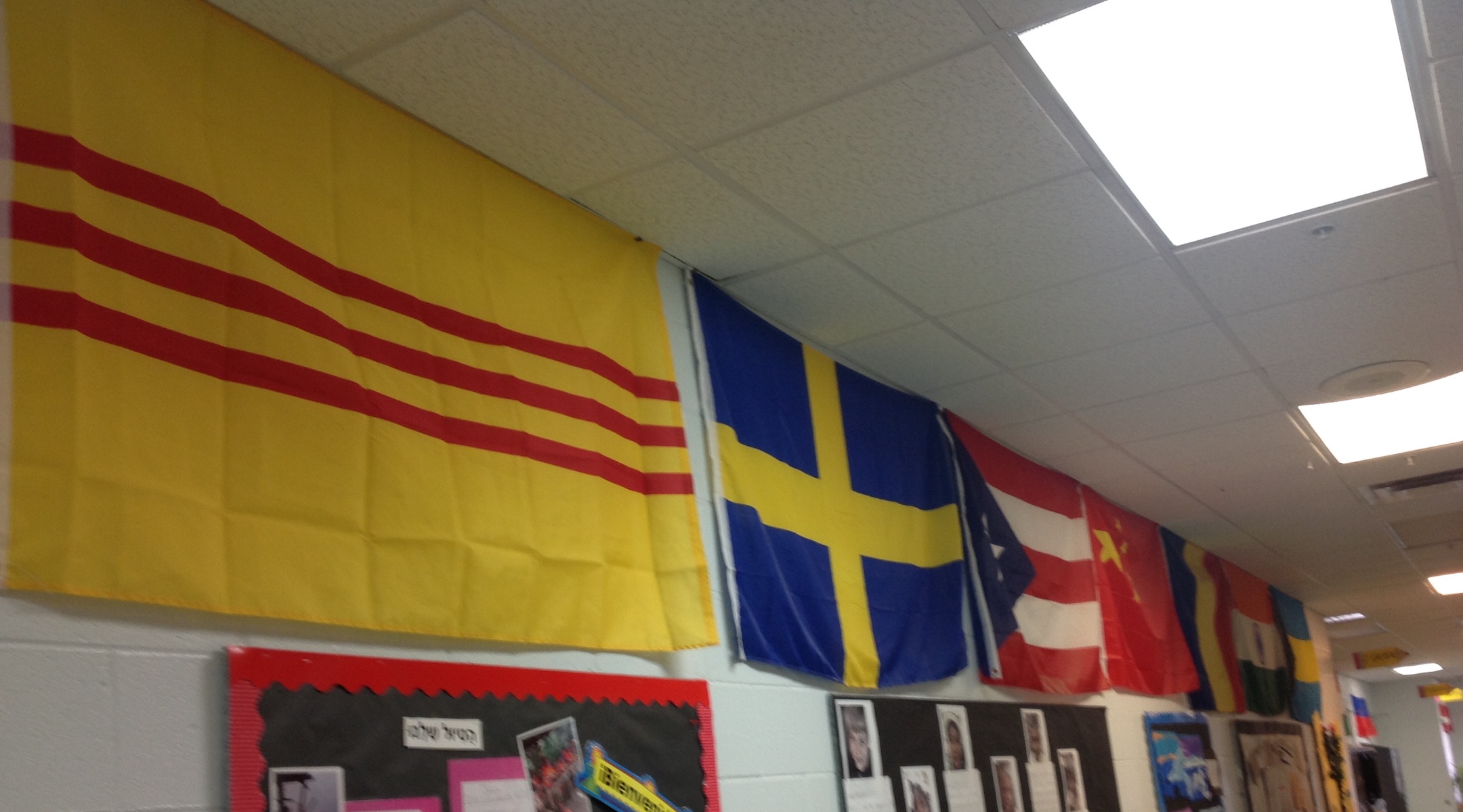 The school has a hallway of flags representing the 40 countries its students' families hail from. (Ben Sales)