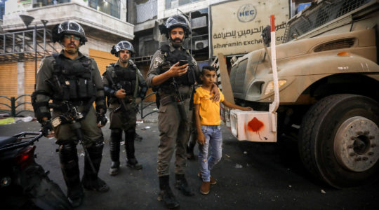 Israeli border police officers arrest a Palestinian youth during clashes with Palestinian protesters in the West Bank city of Hebron, Aug. 11, 2019. Rashida Tlaib and Ilhan Omar were scheduled to visit Hebron and other parts of the West Bank. (Wisam Hashlamoun/Flash90)