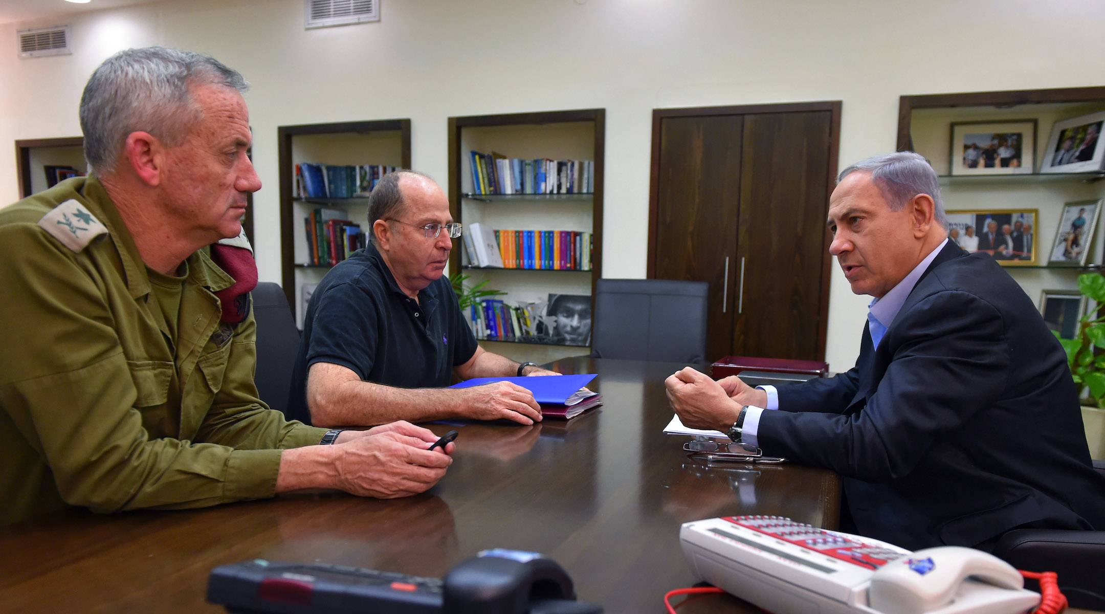 Nentanyahu, Defense Minister Moshe Yaalon and Gen. Benny Gantz (left) meet during the 2014 Gaza War. Gantz and Yaalon are now running against Netanyahu in the Israeli election, but they may all be forced to share power once it's over. (Ariel Harmoni/Getty Images)