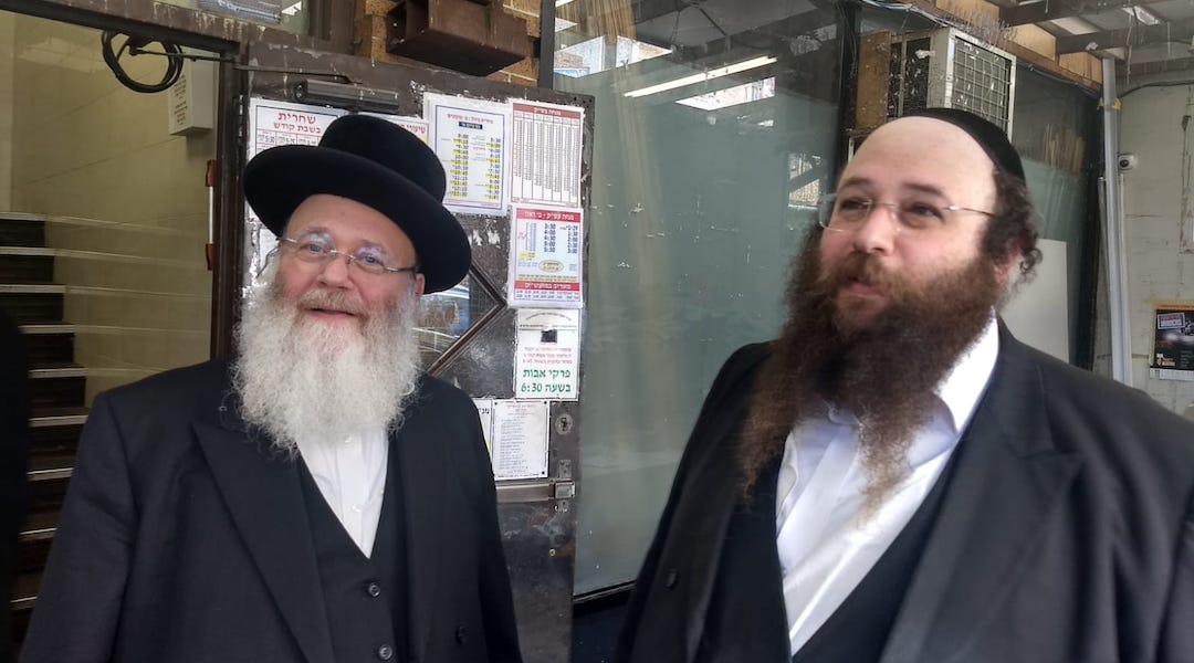 Yosef Rapaport, left, and his son Alex do not feel that life has become more dangerous for Orthodox Jews in Brooklyn. They say attacks on Jews are nothing new. (Ben Sales)