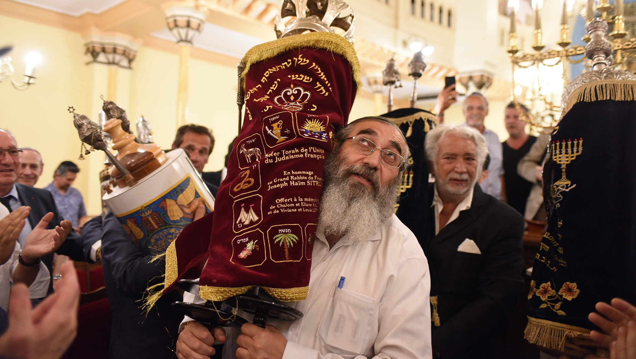 French Jews celebrating the inauguration of a new Torah scroll at the Grand Synagogue of Nice on July 11, 2019. (Courtesy of Consistoire Nice/Henri Belhassen)