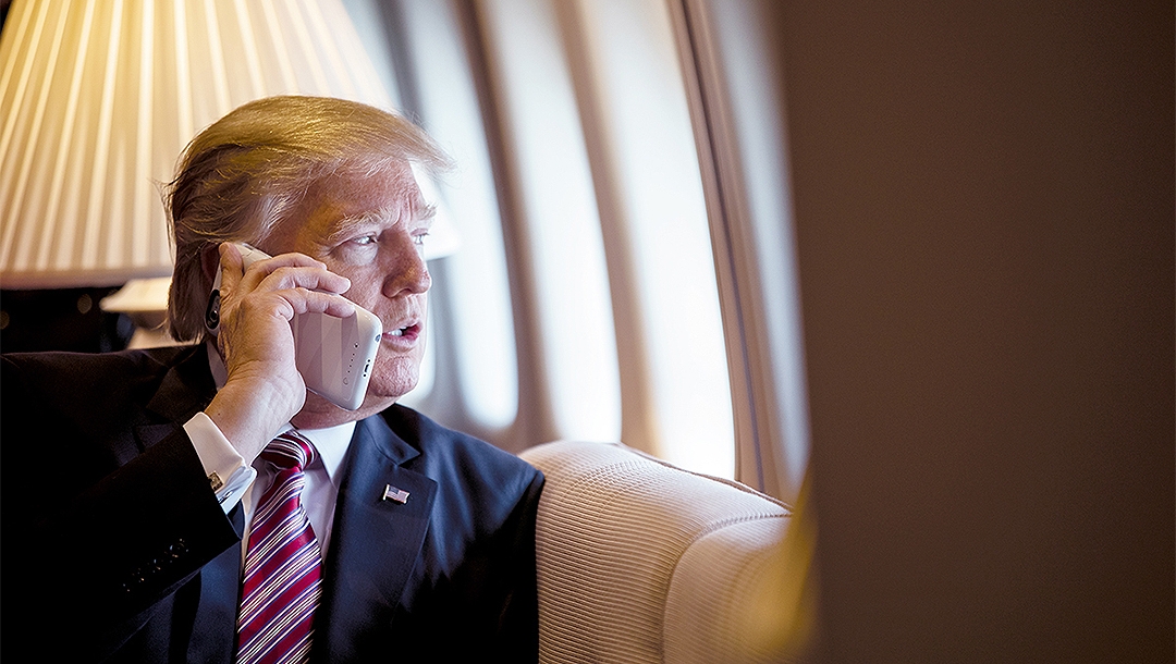 President Donald Trump talking on the phone aboard Air Force One during a flight to Philadelphia, Pennsylvania on January 26, 2017. (Official White House Photo by Shealah Craighead)