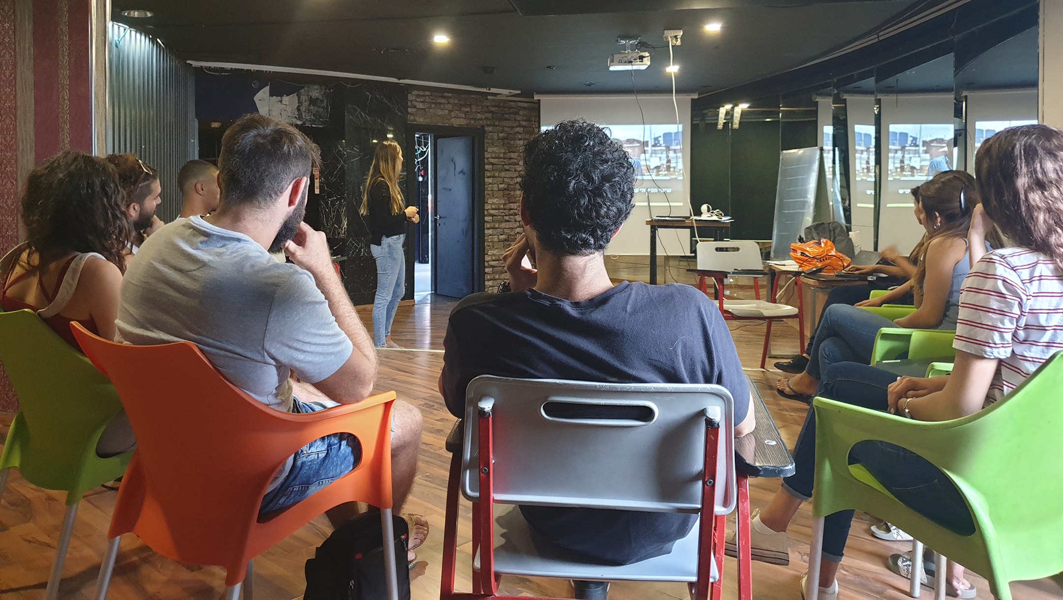 Young Israelis receiving training by volunteers at what used to be the Pussycat strip club in Tel Aviv, Israel on Oct. 7, 2019. (Cnaan Liphshiz/JTA)