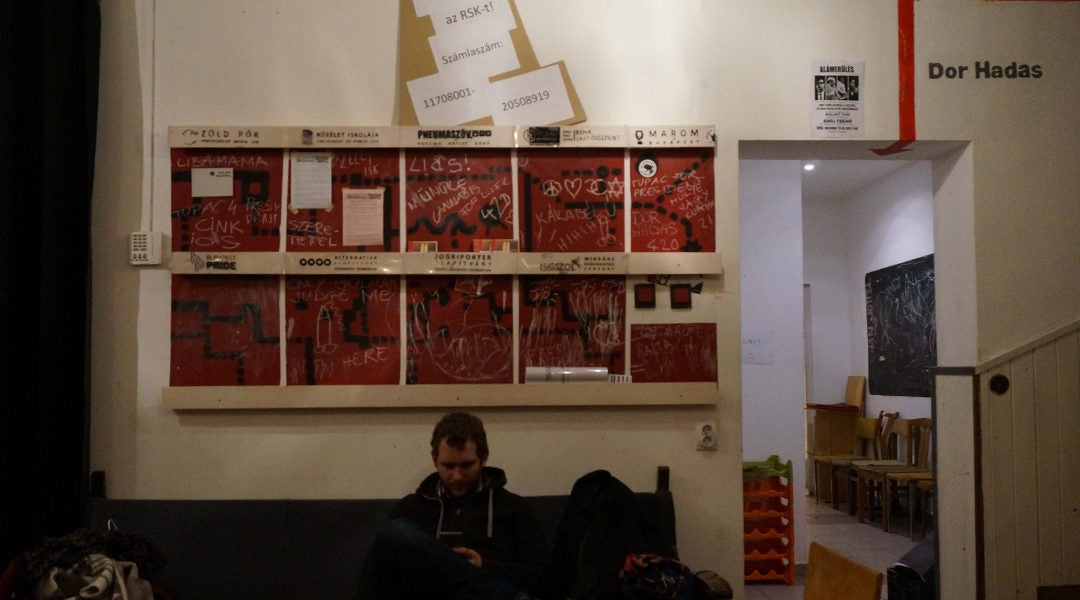 A man reading his cellphone at the Aurora center in Budapest, Hungary on Jan. 12, 2017. (Cnaan Liphshiz)