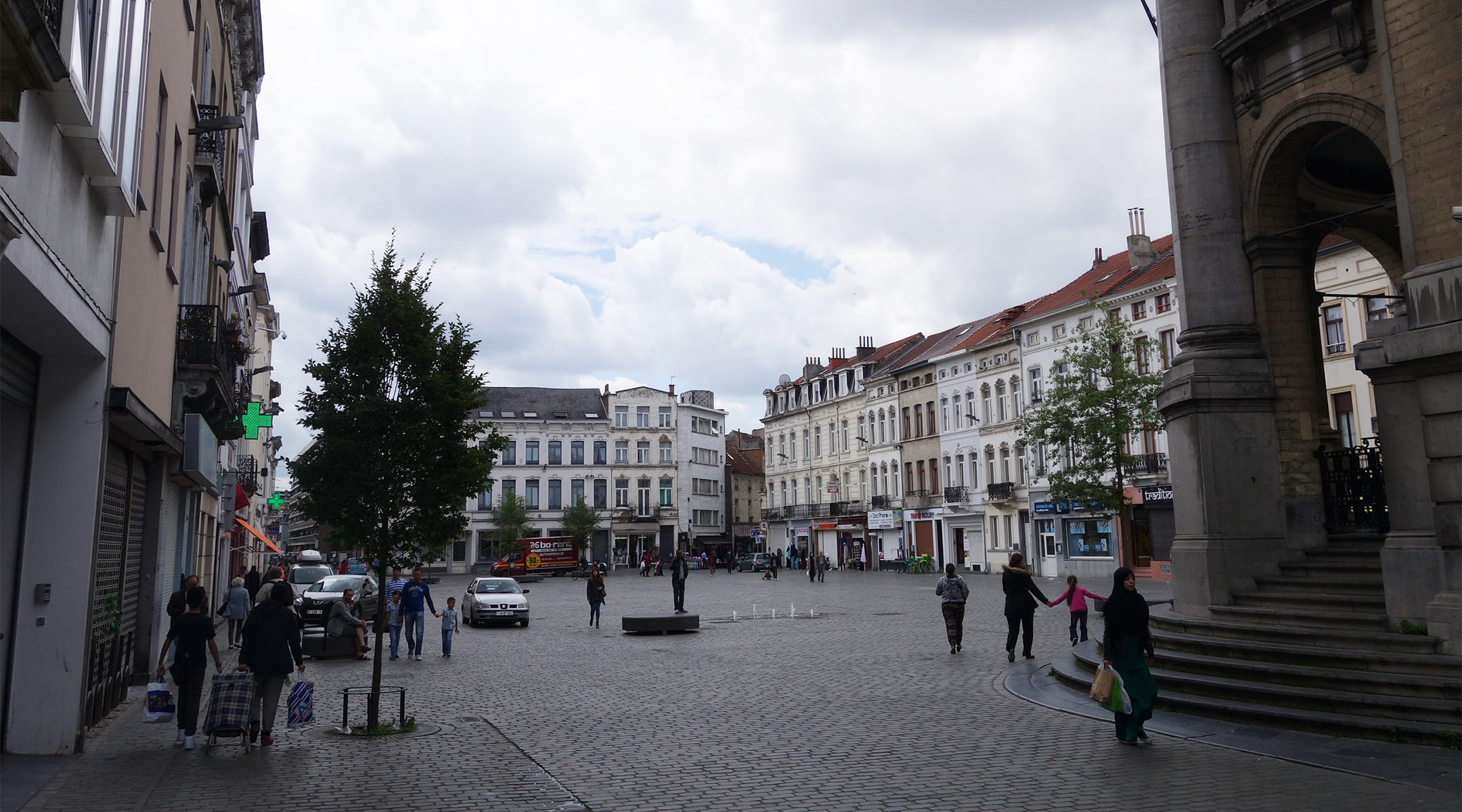 Pedestrians walking on the City Hall Square of the Molenbeek district of Brussels, Belgium on June 29, 2016. (Karmakolle/Wikimedia Commons)