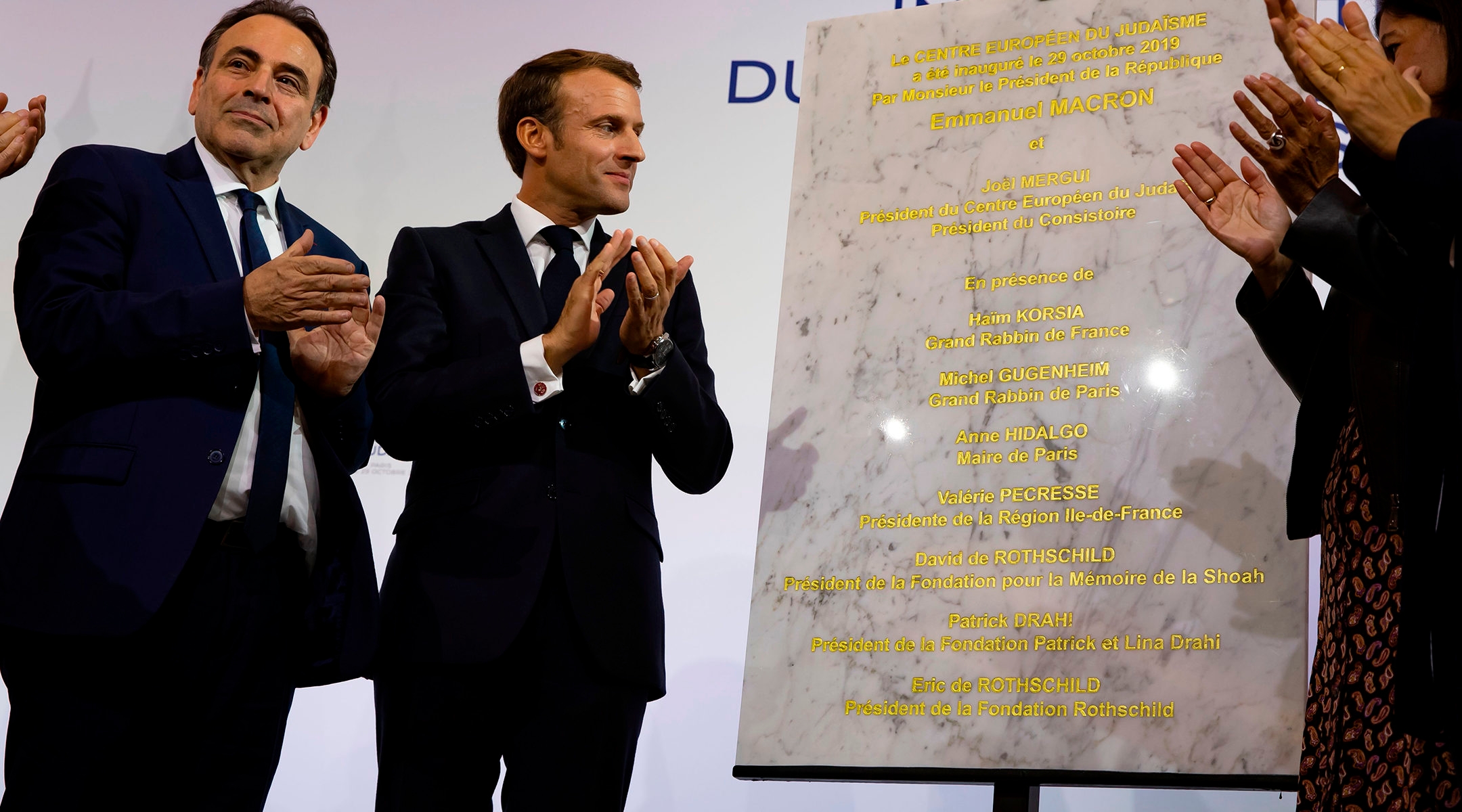 Consistoire President Joel Mergui, left, and French President Emmanuel Macron celebrating the inauguration in Paris, France of a new Jewish community center on Oct. 29, 2019.