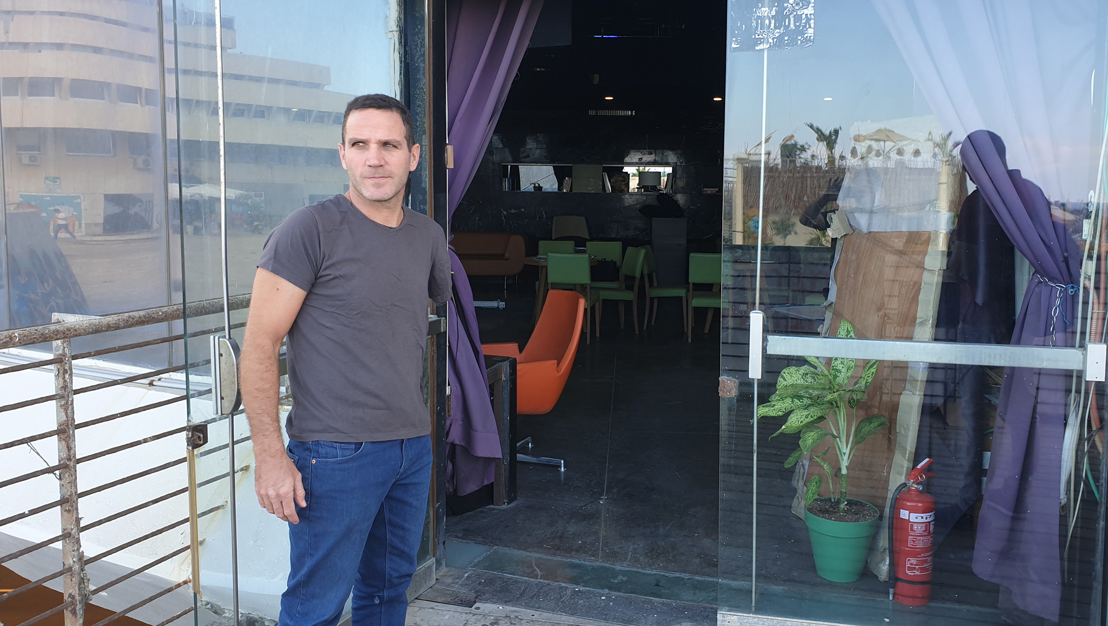 Social activist Yakir Segev standing outside what used to be the Pussycat strip club in Tel Aviv, Israel on Oct. 7, 2019. (Cnaan Liphshiz/JTA)