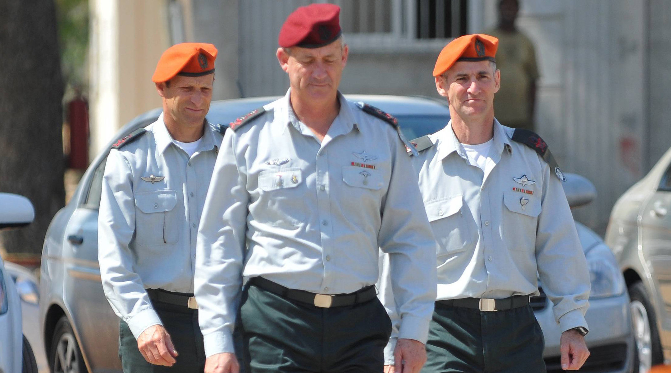 Chief-of-Staff Benny Gantz walks in front of the outgoing head of the Home Front Command, Yair Golan (right), and incoming Brigadier-General Eyal Eisenberg on June 15, 2011. (Yossi Zeliger/Flash90)