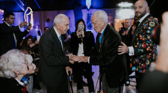 Edward Mosberg, center, and Jonny Daniels, right, celebrating with Jozef Walaszczyk his centenary birthday party in Warsaw, Poland on Nov. 14, 2019. (From the Depths)