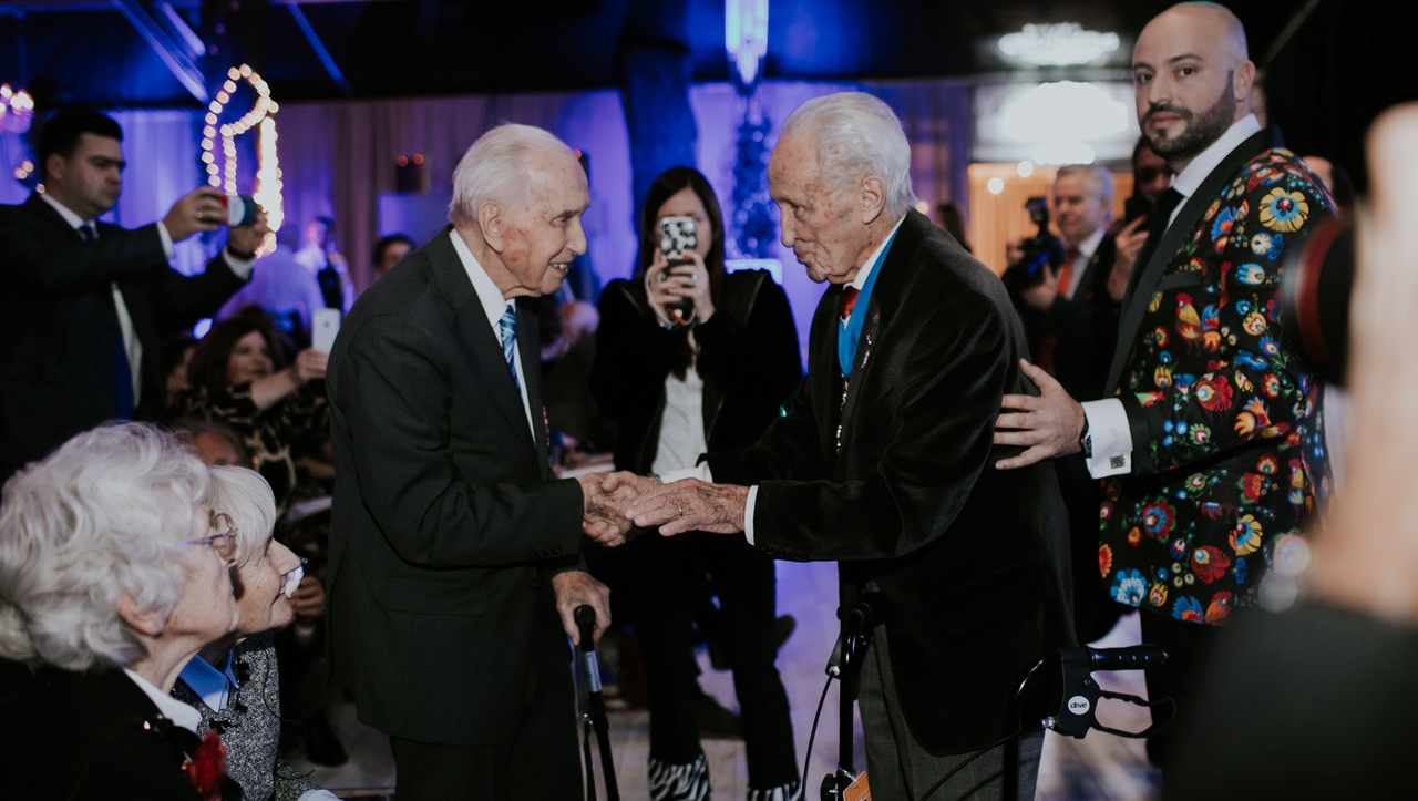 Edward Mosberg, center, and Jonny Daniels, right, celebrating with Jozef Walaszczyk his centenary birthday party in Warsaw, Poland on Nov. 14, 2019. (From the Depths)