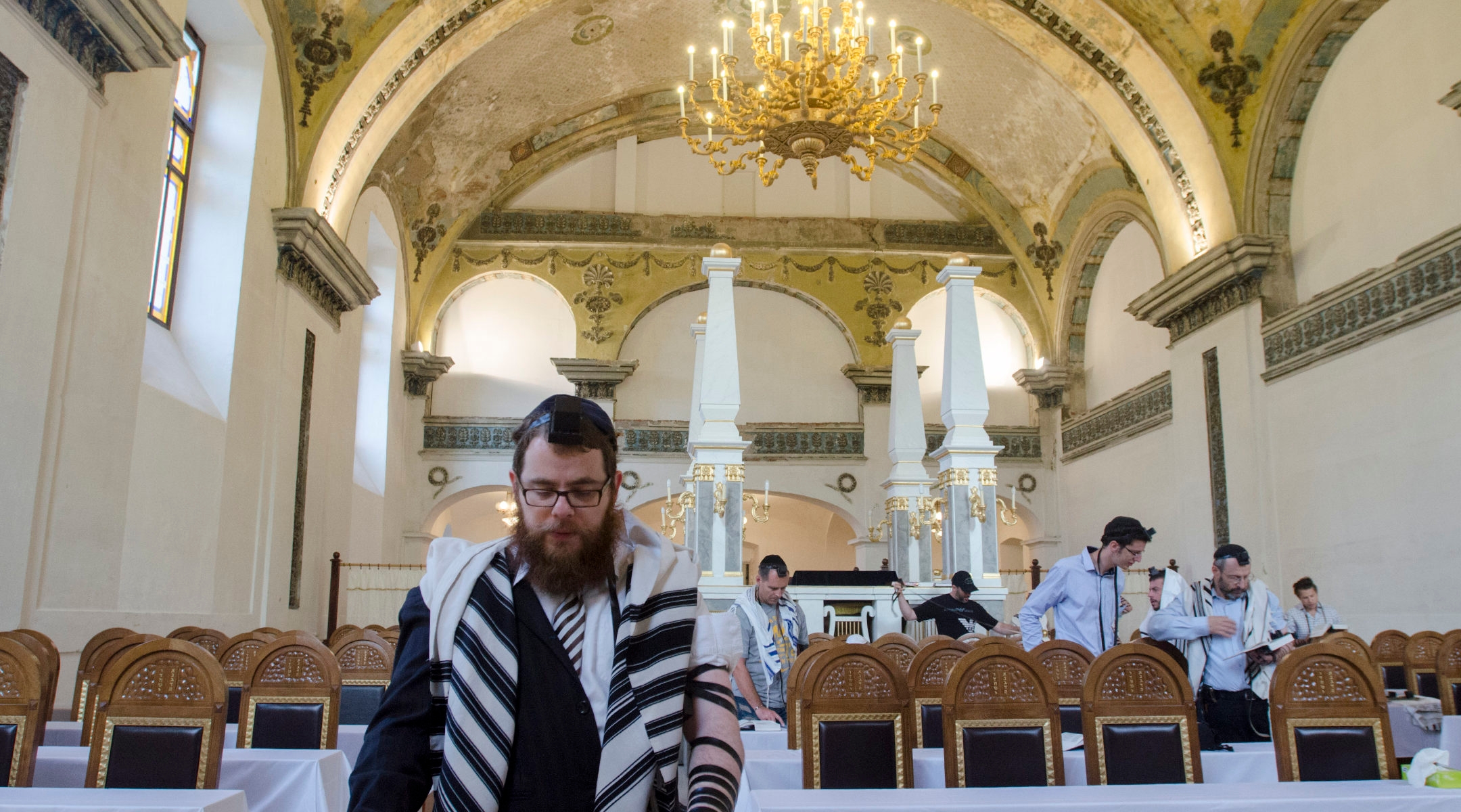 Rabbi shlomo Koves, left, praying at his Obuda Synagogue in Budapest, Hungary on Oct. 7, 2019. (Courtesy of EMIH)