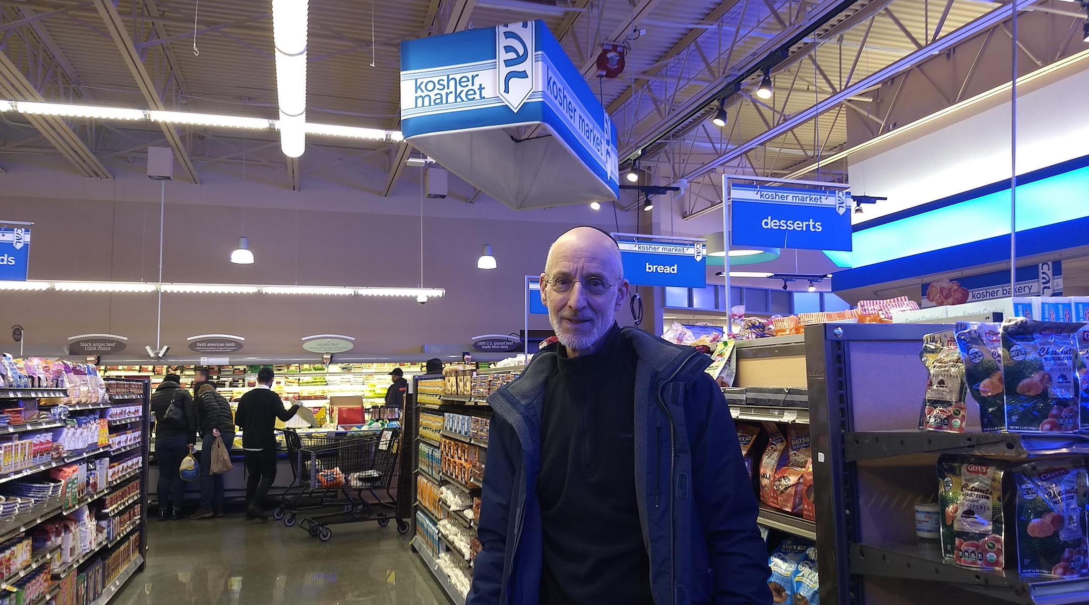 Howard Rieger, a former CEO of the Jewish Federations of North America, stands in a new kosher section in a West Rogers Park grocery store. (Ben Sales)