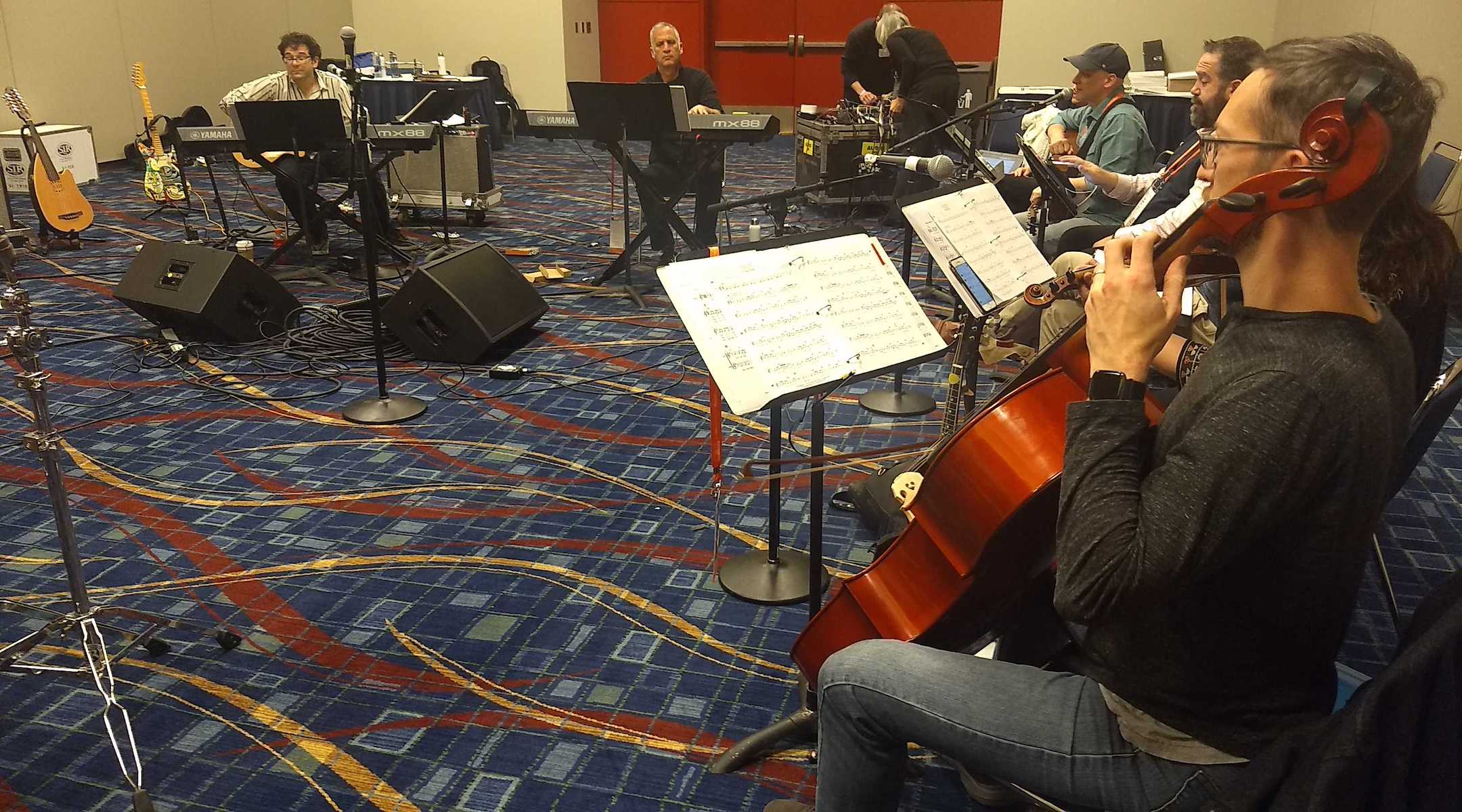 Members of the Reform Biennial Friday night service band practice on Thursday, Dec. 12 in Chicago. Josh Nelson, the biennial's artistic director, is at left. (Ben Sales)