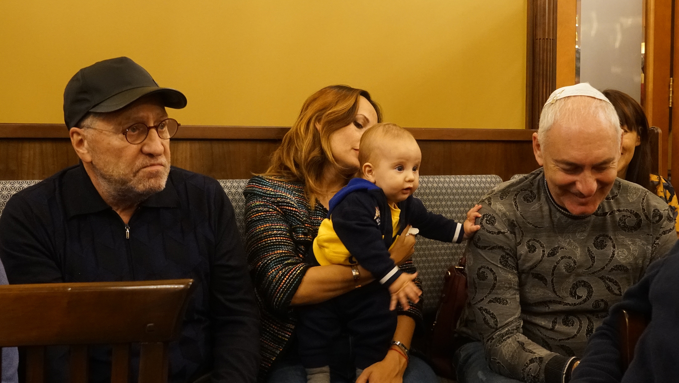 Yevgeniy Kouspin, his son Benjamin and wife Anzhelika at the synagogue of Jurmala, Latvia on Oct. 29, 2019. (Cnaan Liphshiz)