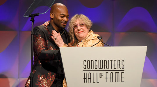 Allee Willis receiving an award from Brandon Victor Dixon during the Songwriters Hall of Fame 49th Annual Induction in New York, the United States on June 14, 2018. (Larry Busacca/Getty Images for Songwriters Hall Of Fame)