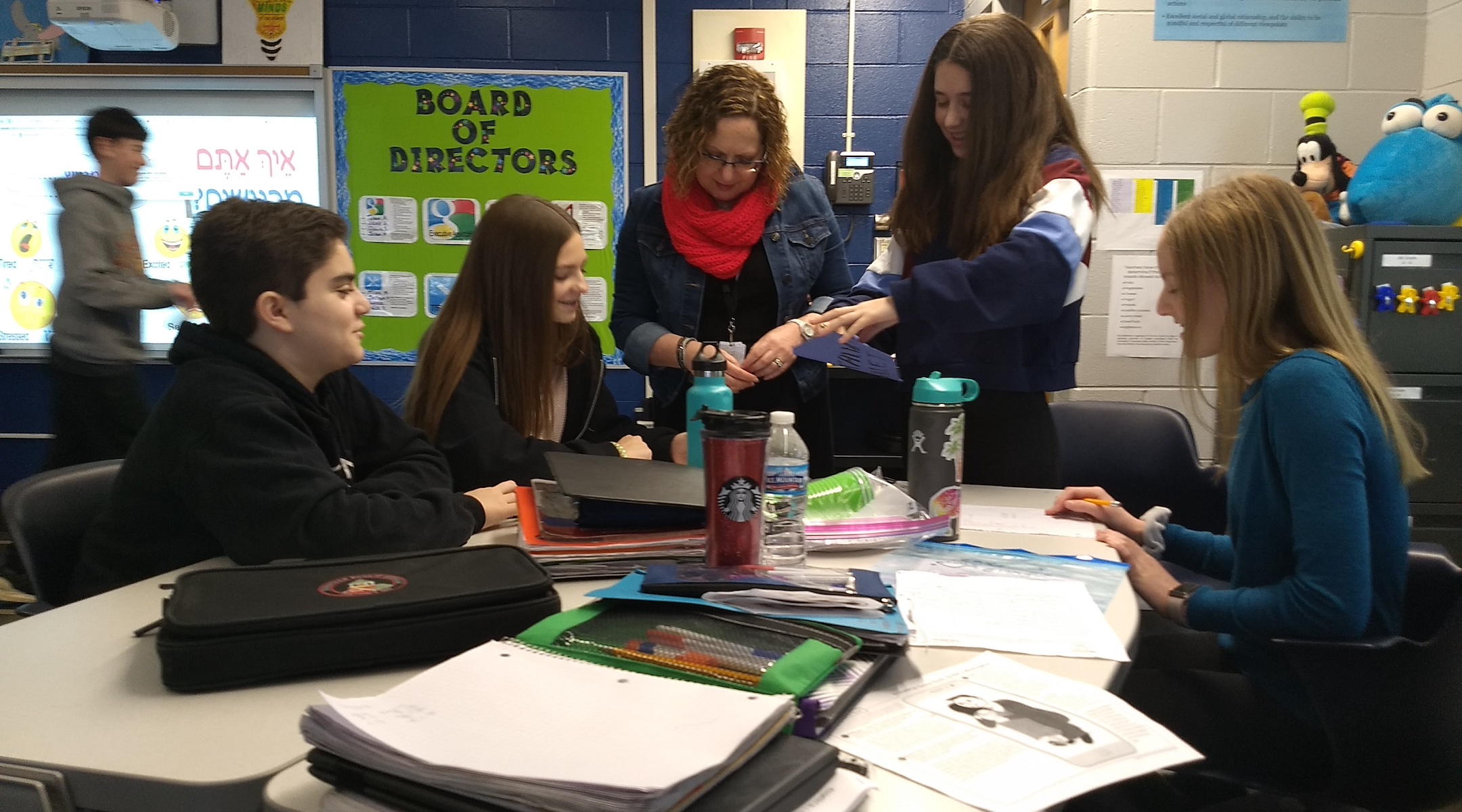 Teacher Osnat Lichtfeneld (center) guides students in an 8th grade Hebrew class at Alan B. Shepard Middle School in Deerfield, Ill. on Dec. 13. (Ben Sales)