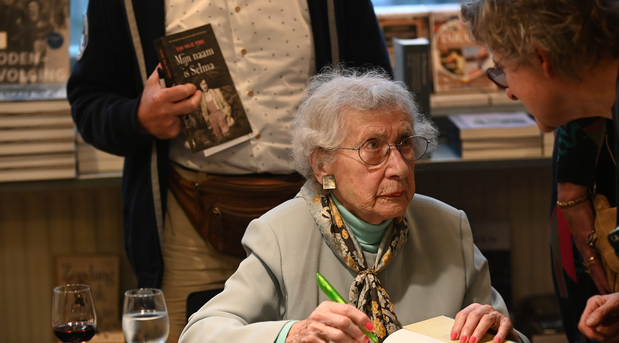 Selma van de Perre singing her book at the National Holocaust Museum in Amsterdam, the Netherlands on Jan. 9, 2020. (Cnaan Liphshiz)