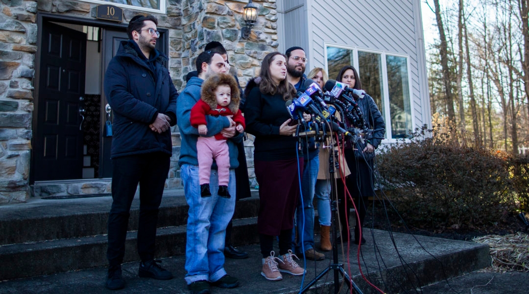 Nicky Cohen and David Neumann, children of the Dec. 28 Monsey stabbing attack victim Josef Neumann, speaking to the media at New City, New York on January 2, 2020. (Eduardo Munoz Alvarez/Getty Images)